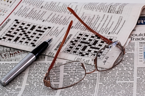 eyeglasses-and-ballpoint-pen-on-newspaper.jpg